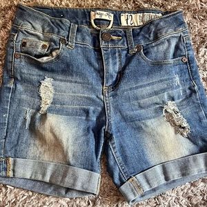 Cute light blue faded ripped shorts (size 12 junior) from Indigo Rein. 333